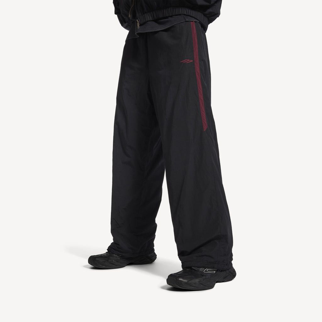 BALENCIAGA REVERSIBLE TRACKSUIT PANTS IN BLACK