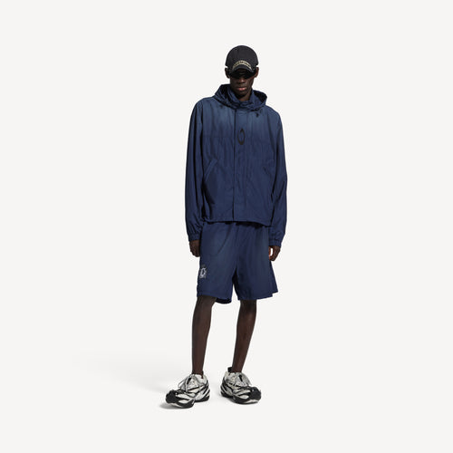 BALENCIAGA HOODED RAIN JACKET IN MARINE BLUE
