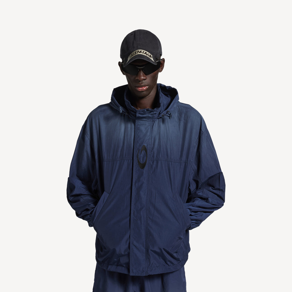 BALENCIAGA HOODED RAIN JACKET IN MARINE BLUE