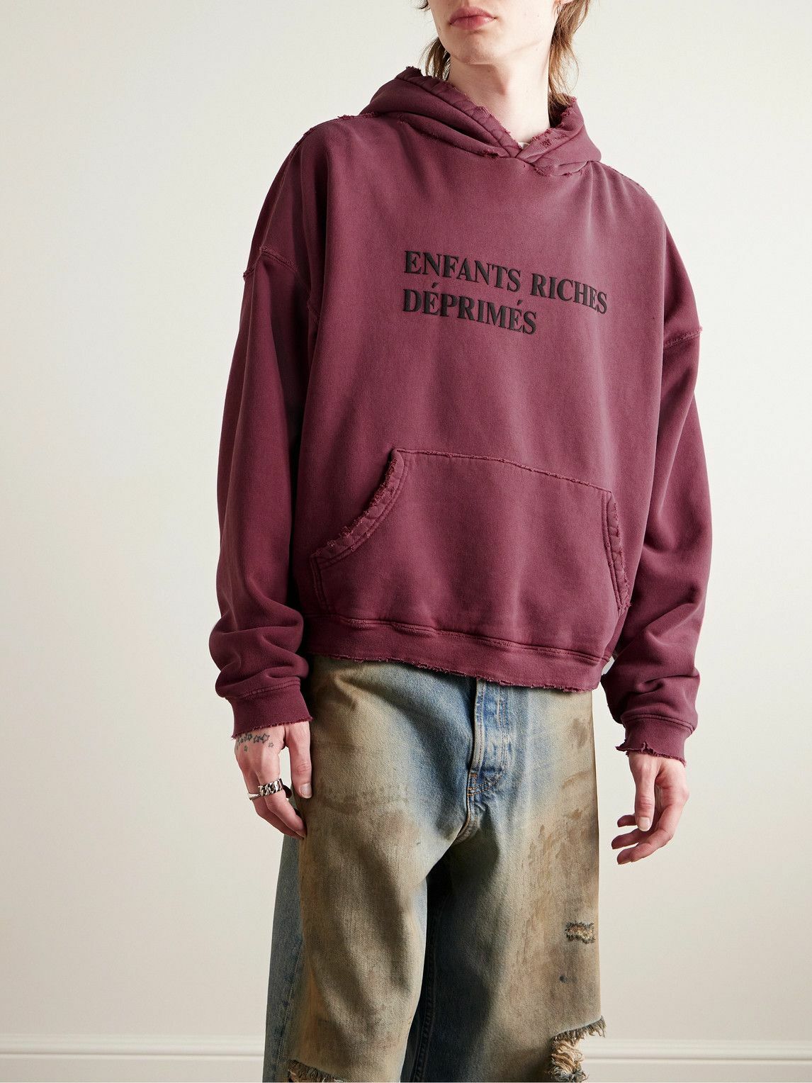 ENFANTS RICHES DÉPRIMÉS THRASHED DISTRESSED LOGO-PRINT COTTON-JERSEY HOODIE IN BURGUNDY