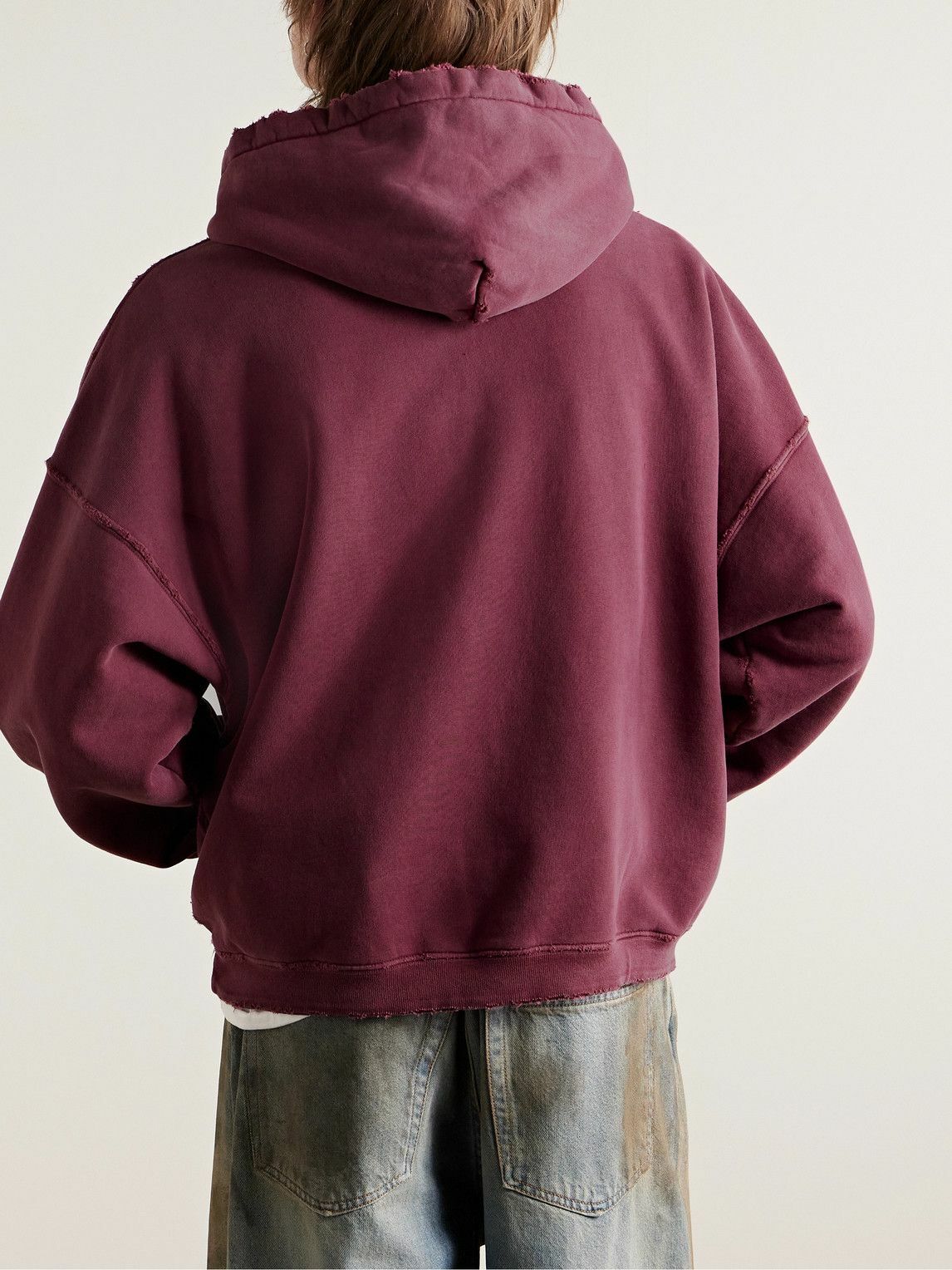 ENFANTS RICHES DÉPRIMÉS THRASHED DISTRESSED LOGO-PRINT COTTON-JERSEY HOODIE IN BURGUNDY
